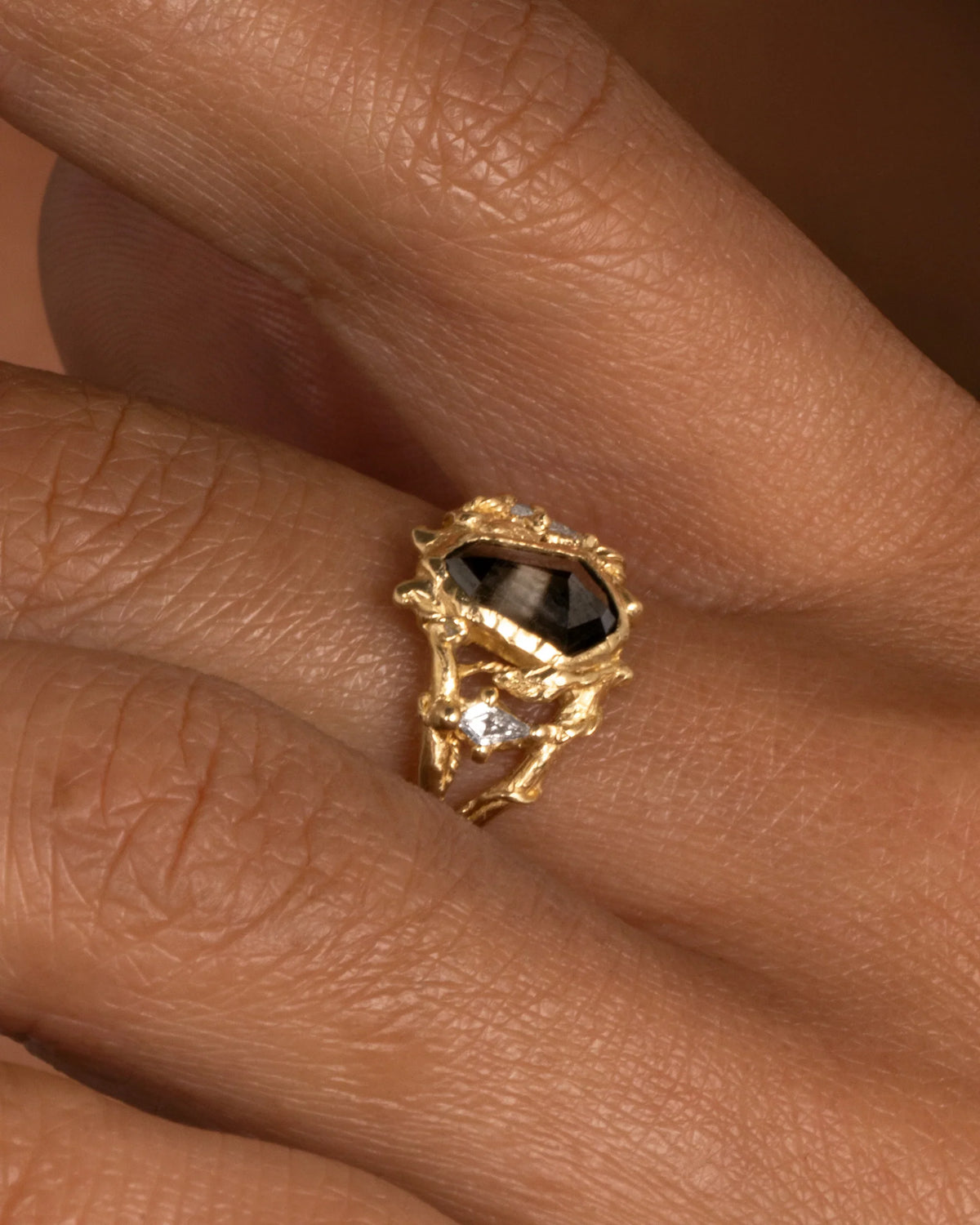 Through The Gates Ring — worn alone on a hand in close-up.
