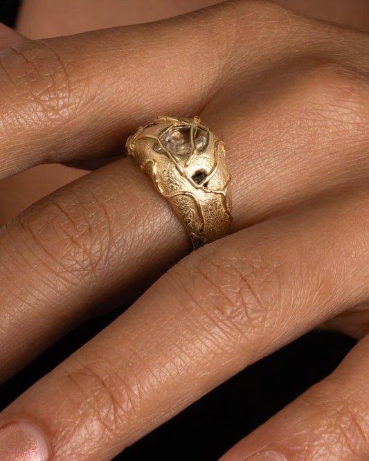 Watch Your Step Ring — worn alone on a hand in close-up.