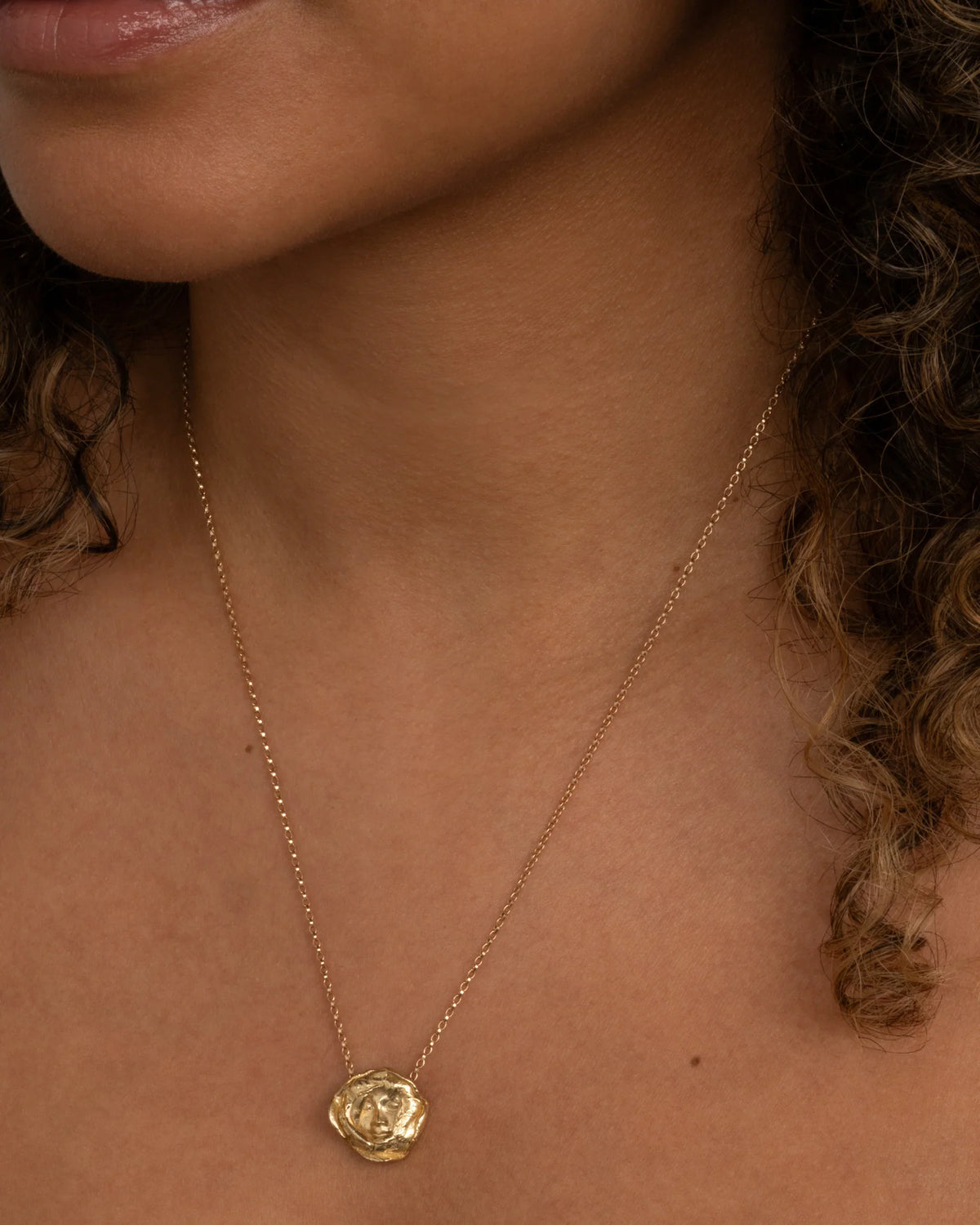 Messenger Pendant Necklace — fine chain worn at the neckline.