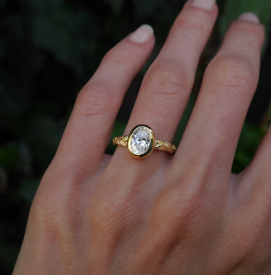 Interlaced Diamond Ring — worn alone on a hand outdoors.
