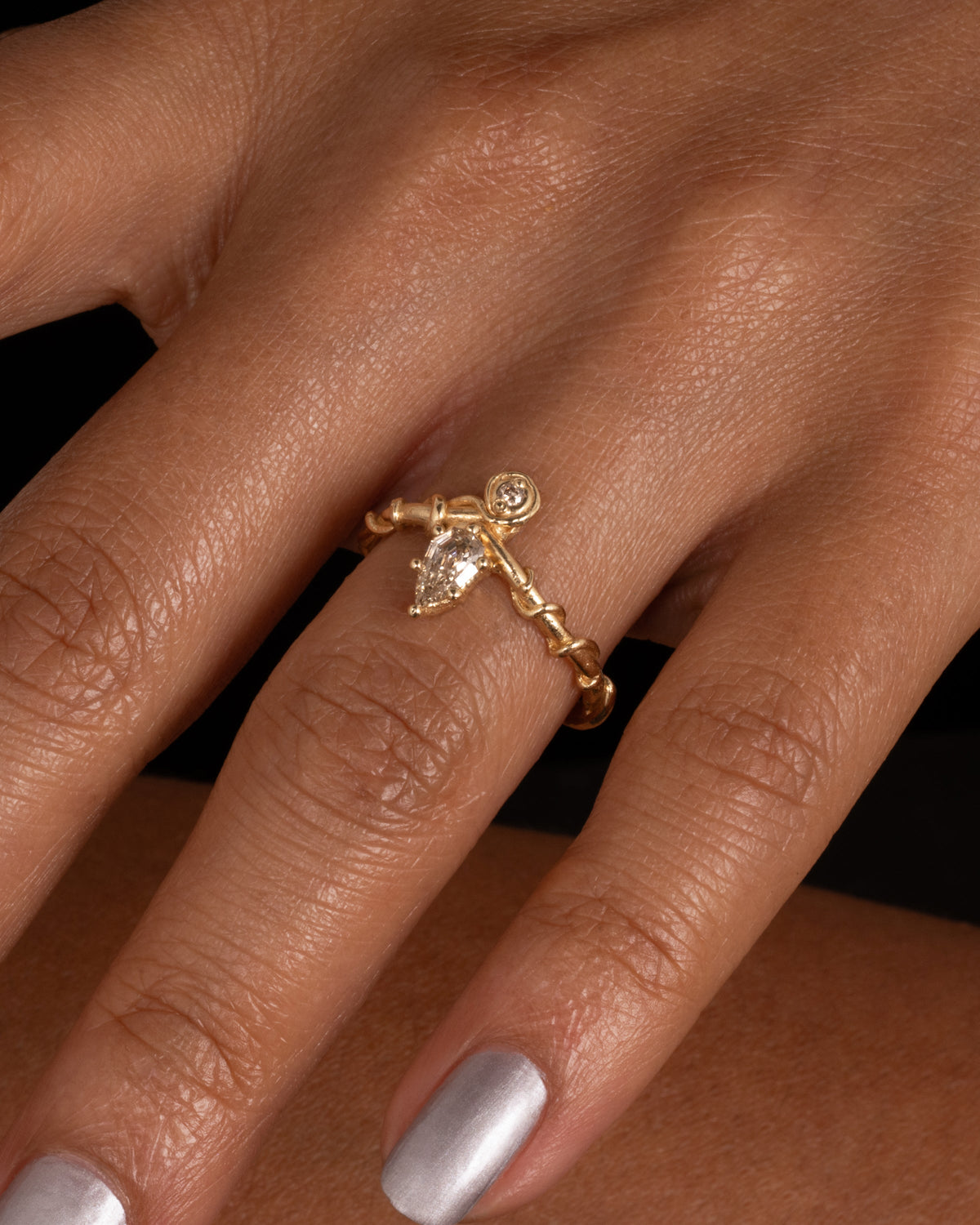 Diadem Diamond Ring — two-stone ring worn on a hand.