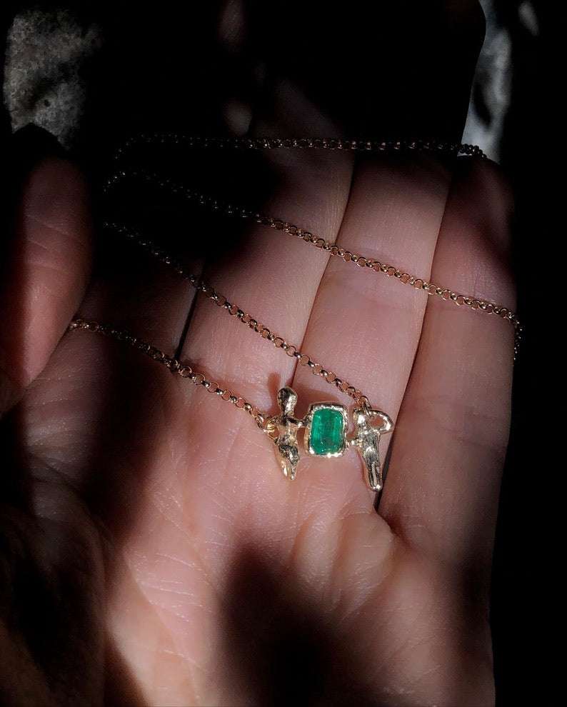 Custom necklace resting in an open hand