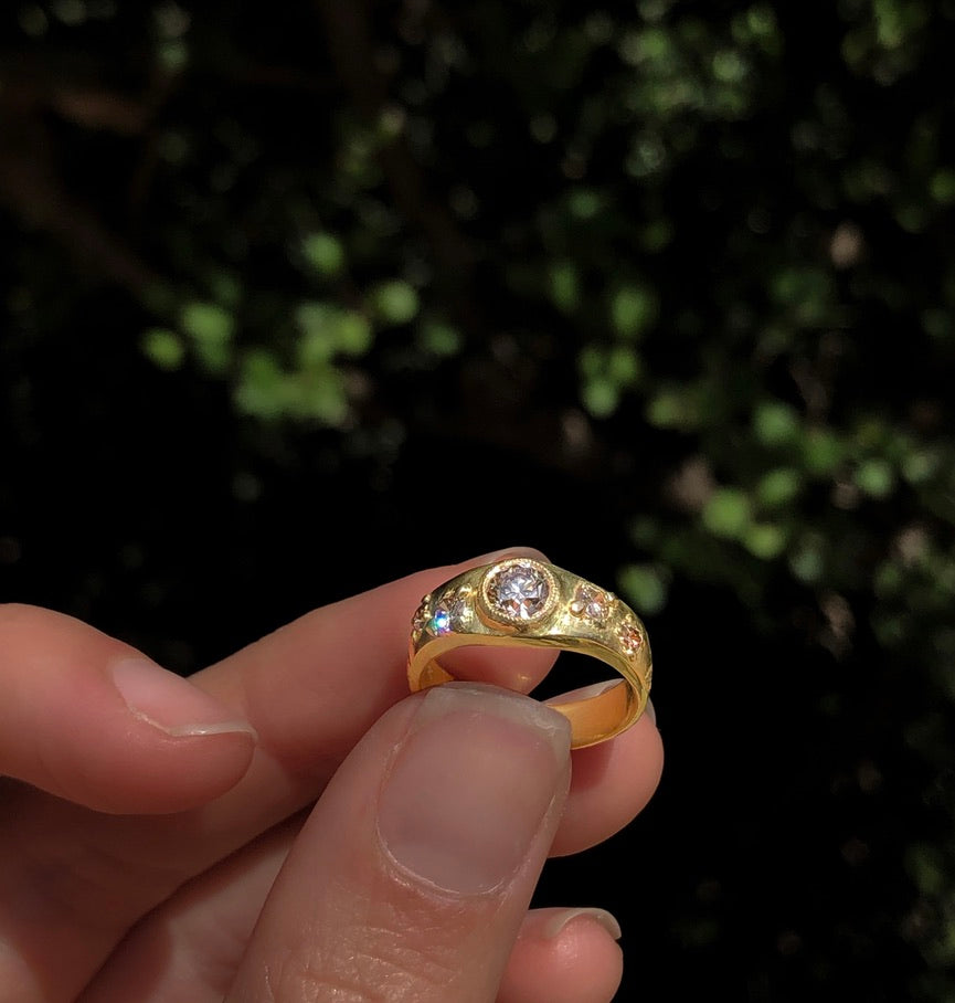 Custom ring held between fingers