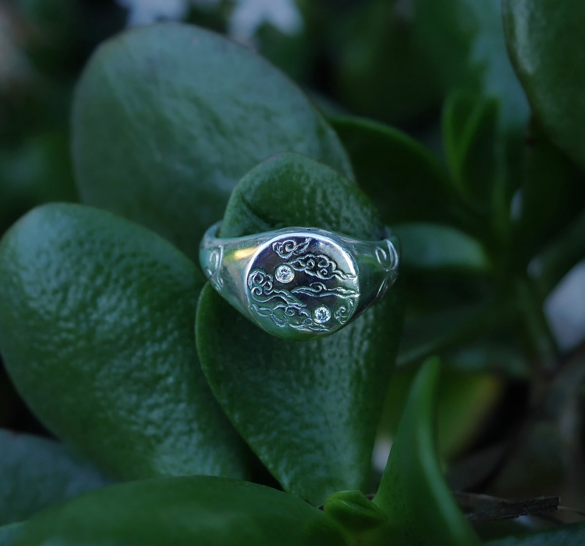 Custom silver signet ring with diamonds