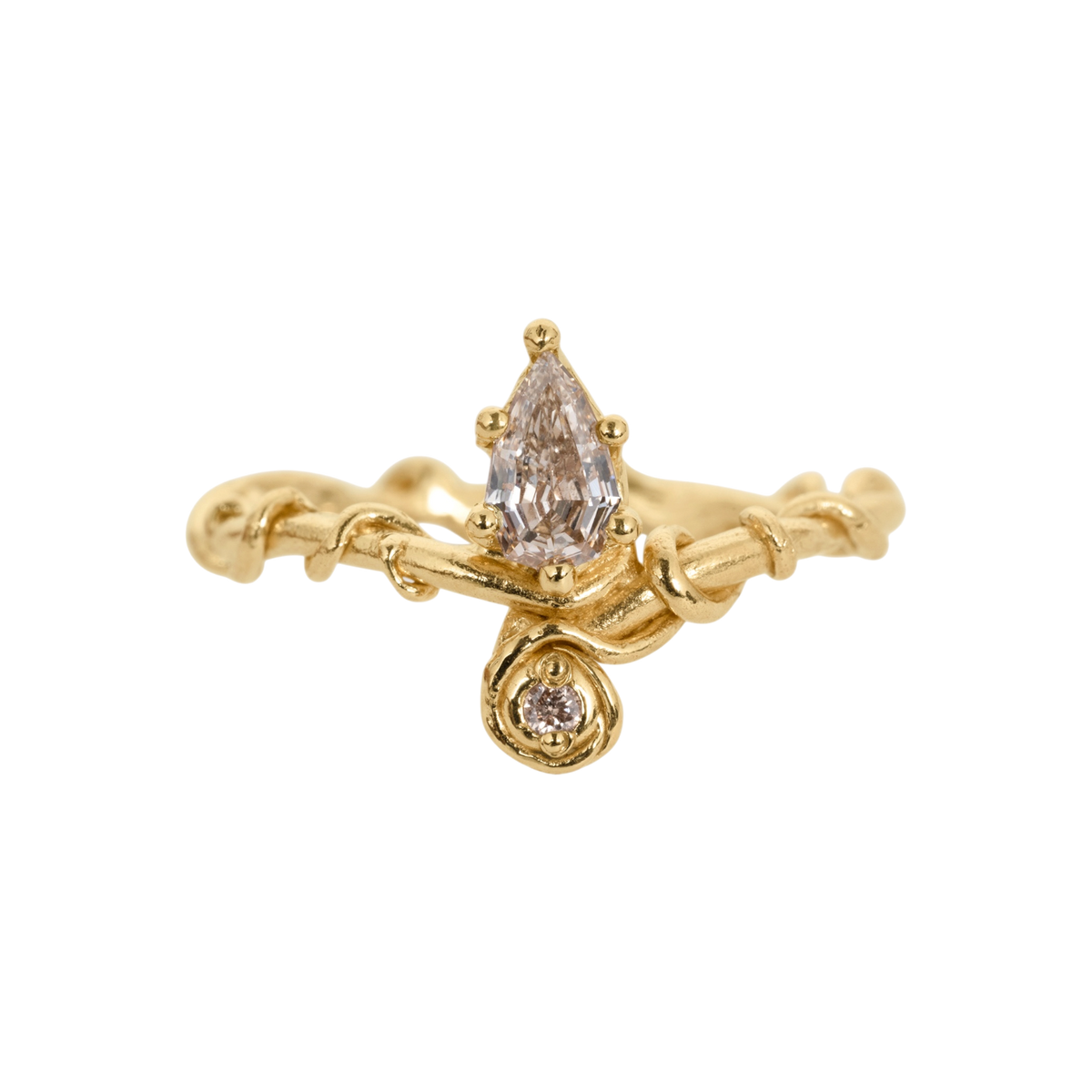 Diadem Diamond Ring — An asymmetric yellow-gold-colored ring pairs a large pear diamond with a smaller round diamond in a sculptural two-stone composition.