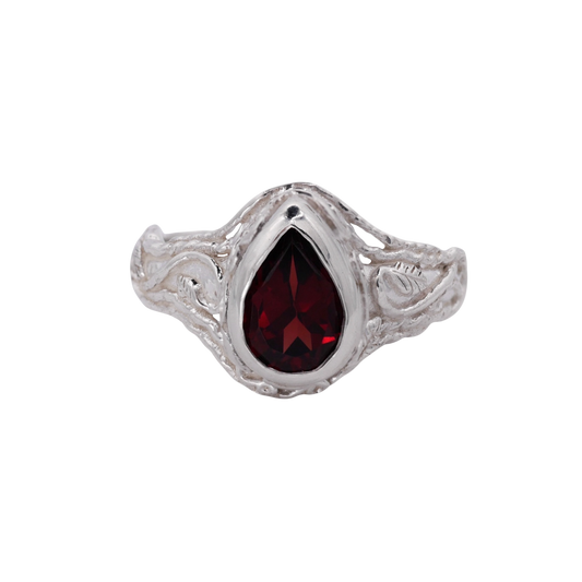 Entangled Ring Silver — A deep-red pear garnet is bezel-set within an open sterling-silver ring of intertwined leaves and vines.