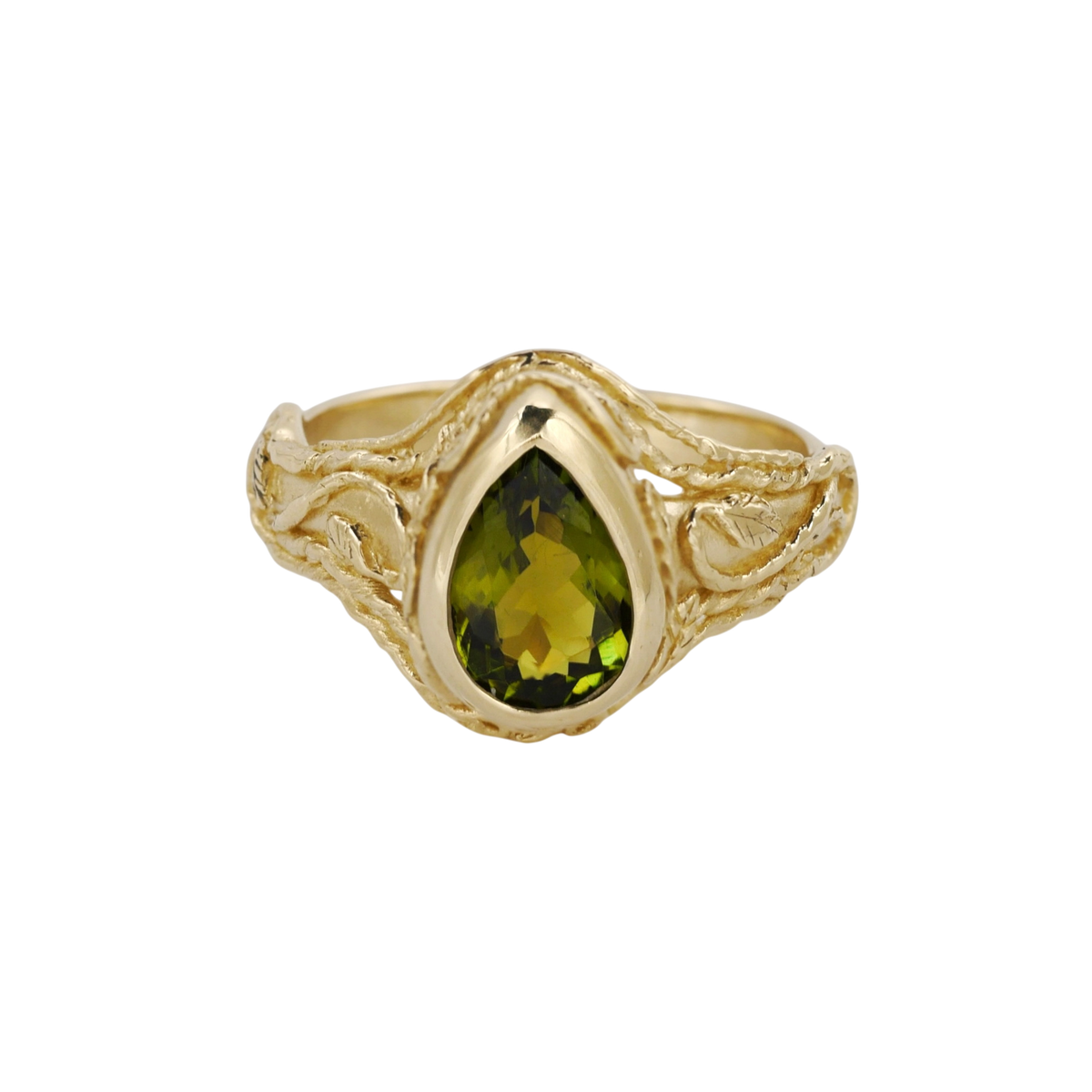 Entangled Ring — An olive-green pear tourmaline is bezel-set within an open yellow-gold ring of intertwined leaves and vines.