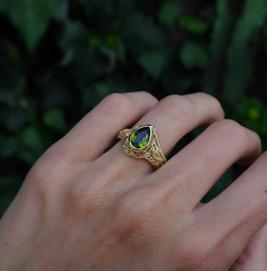 Entangled Ring — worn on a hand outdoors.