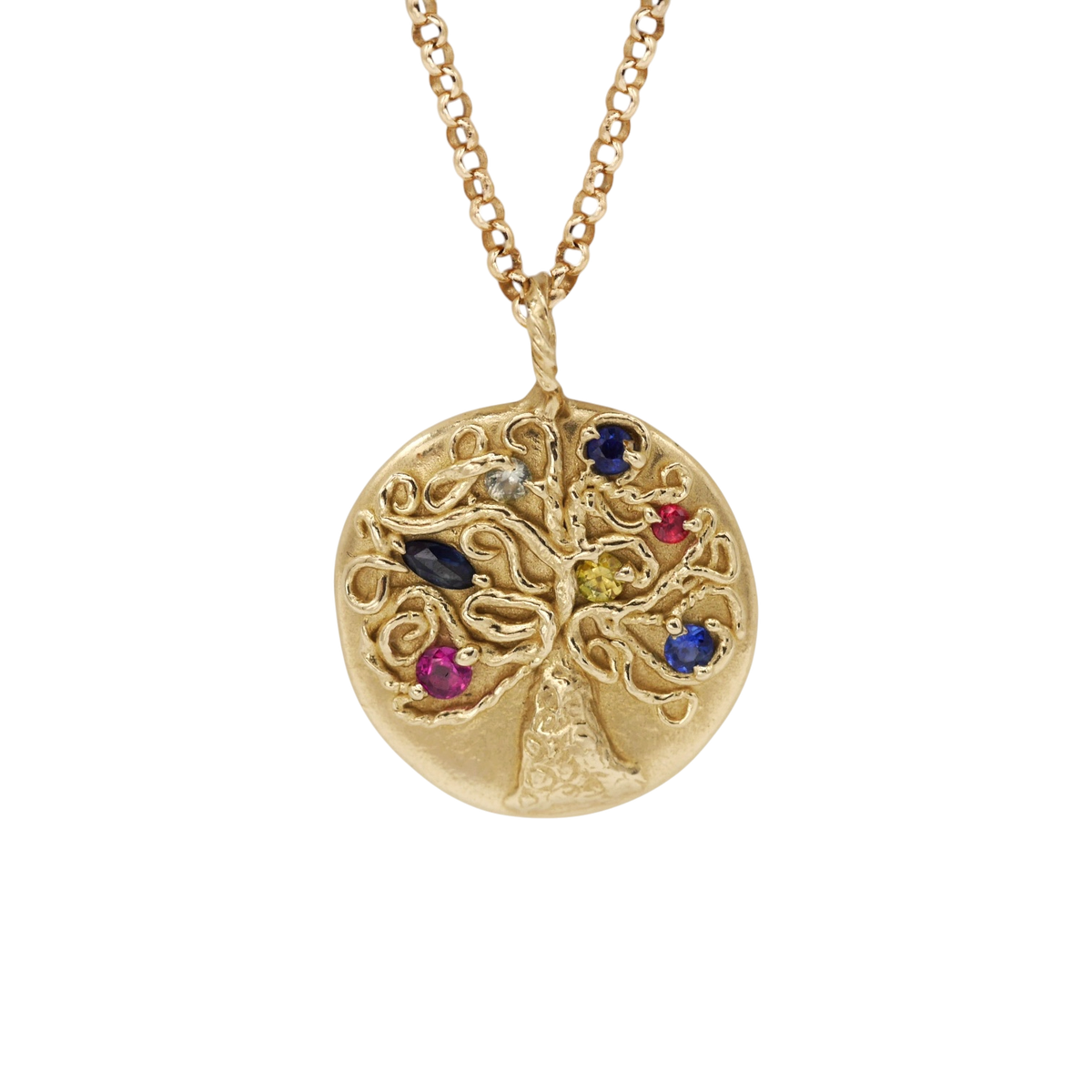 Fruiting Tree Pendant — An oval yellow-gold tree pendant carries seven small sapphires and rubies in blue, yellow, pale, red, and pink tones.