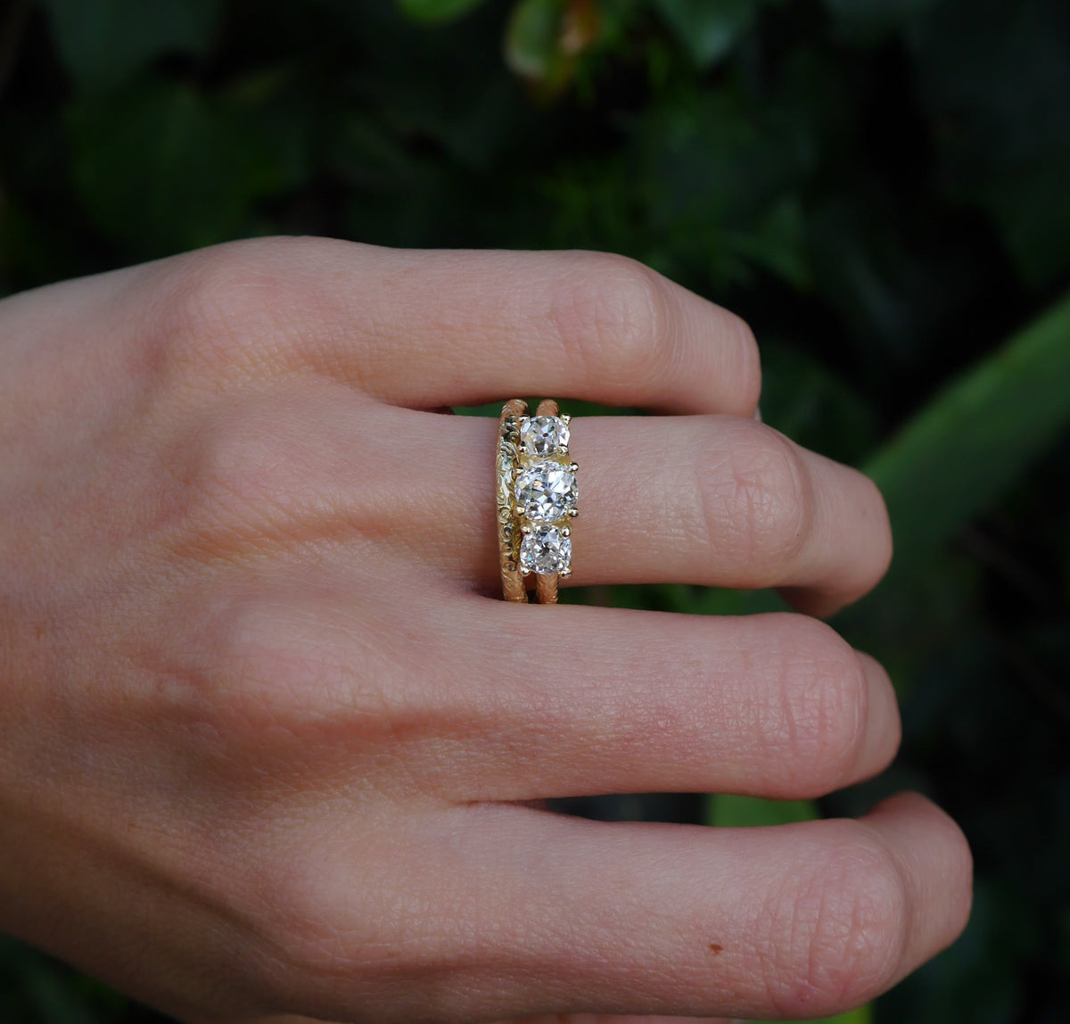 Little Scrolling Band — worn beside a rectangular diamond band.