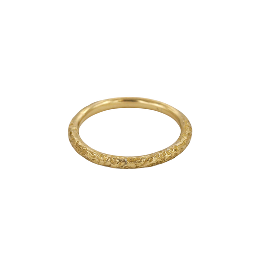Little Scrolling Band — A slim yellow-gold band carries shallow scrolling botanical relief around its rounded exterior.