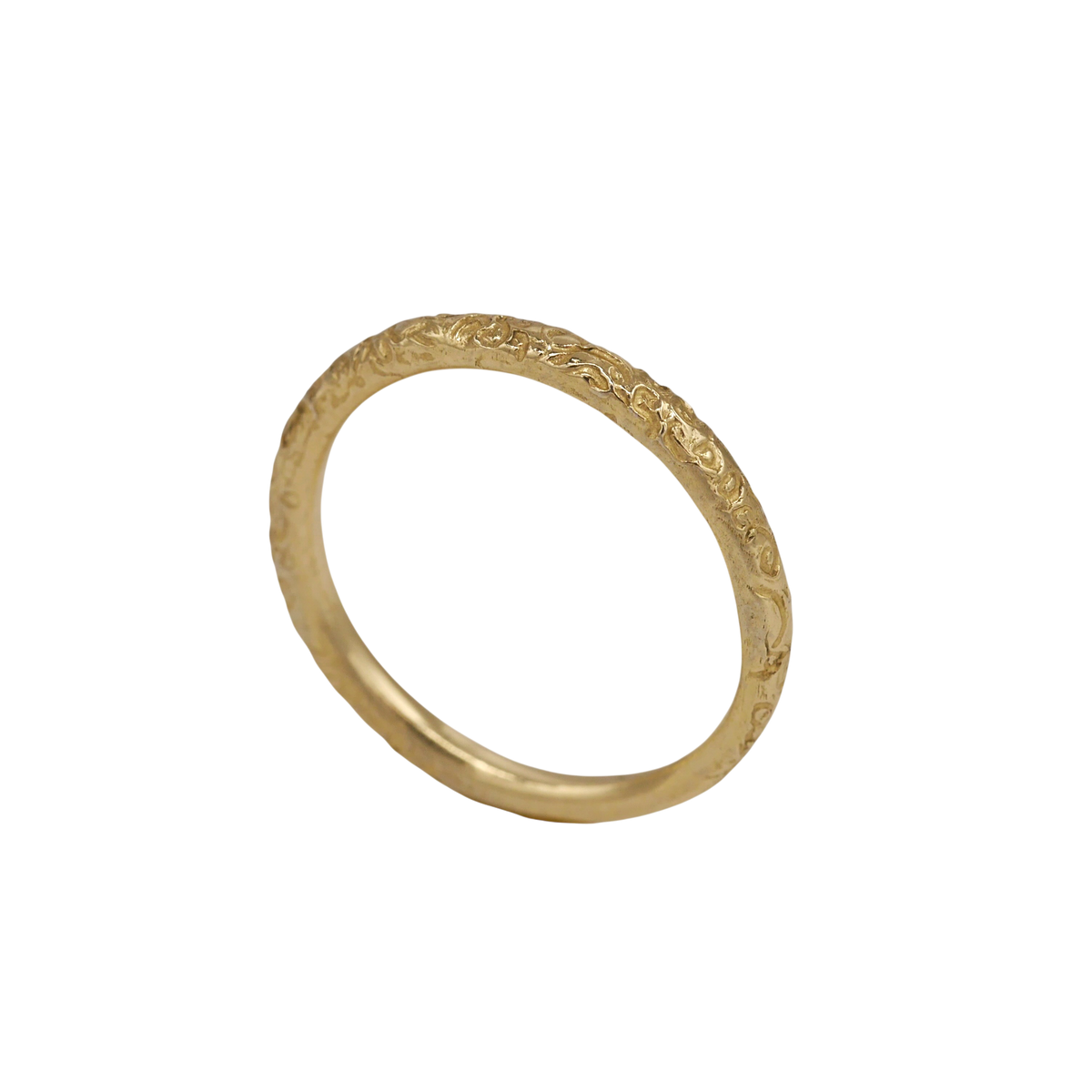 Little Scrolling Band — angled view showing the textured outer surface and smooth inner band.