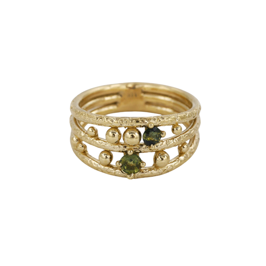 Lost Marbles Ring — Two olive-green round sapphires and polished gold spheres are scattered between three textured yellow-gold rails.