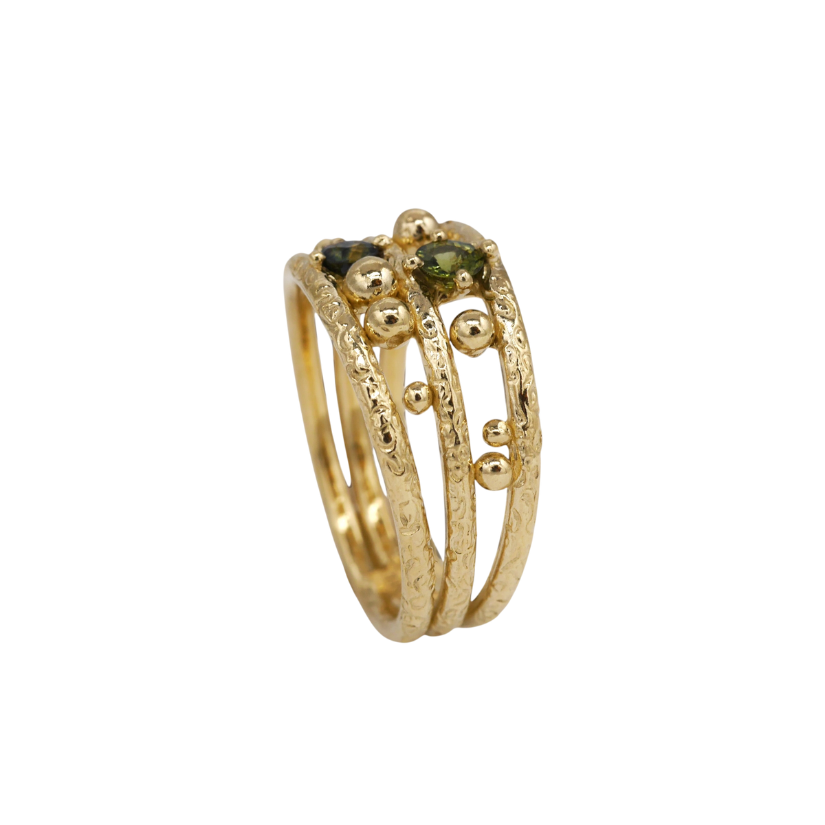 Lost Marbles Ring — side view showing the joined bands and raised gold spheres.