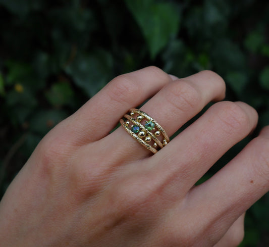 Lost Marbles Ring — worn alone on a hand outdoors.