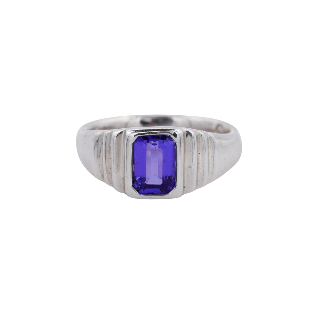 Meeting Place Ring Silver — A violet-blue rectangular tanzanite is bezel-set in a polished, ridged sterling-silver signet ring.