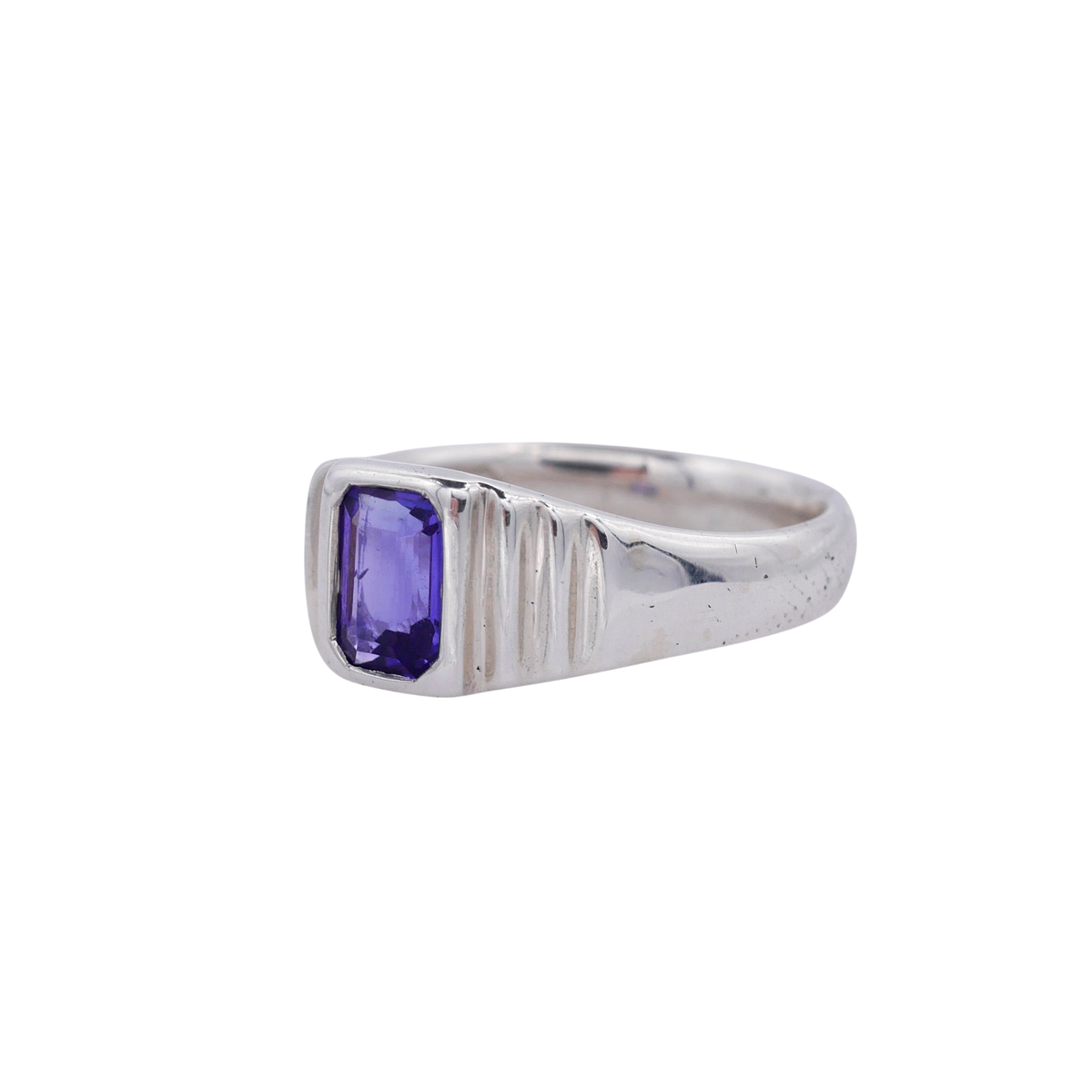 Meeting Place Ring Silver — three-quarter view showing the tanzanite bezel and stepped shoulders.