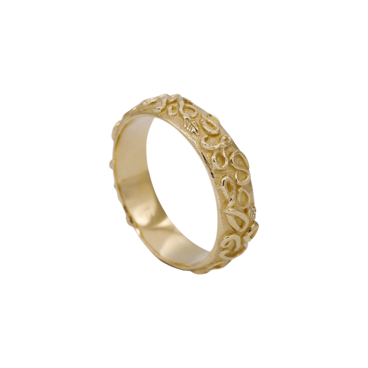 Revelation Band — angled view showing the scrolling relief around the band.