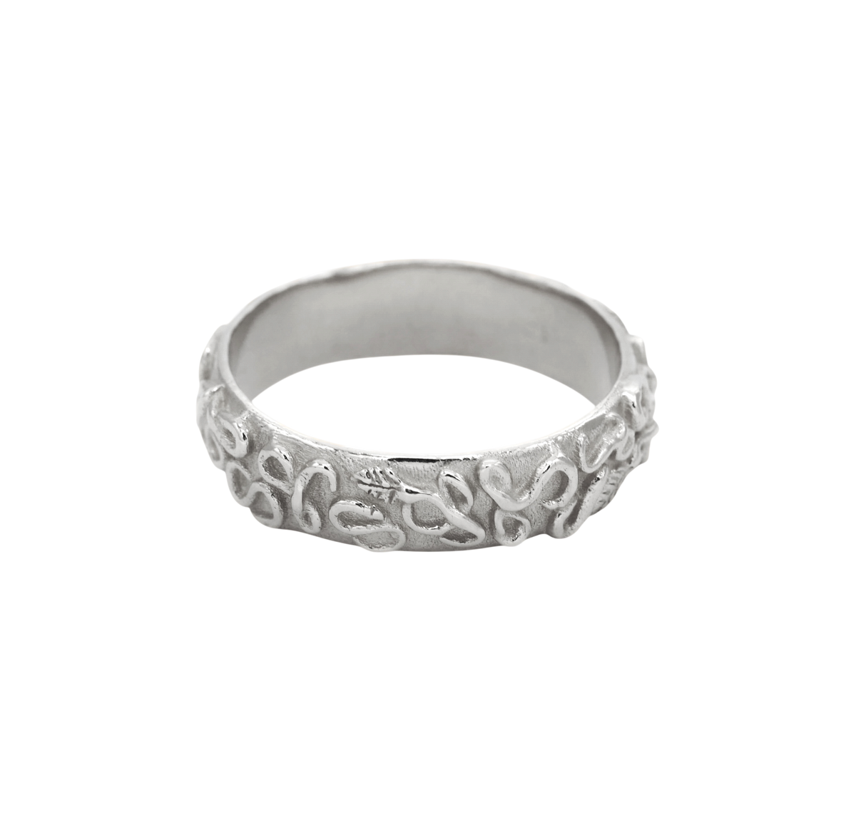 Revelation Band Silver — A broad sterling-silver band is wrapped in raised looping vines, leaves, and scrolling relief over a textured ground.