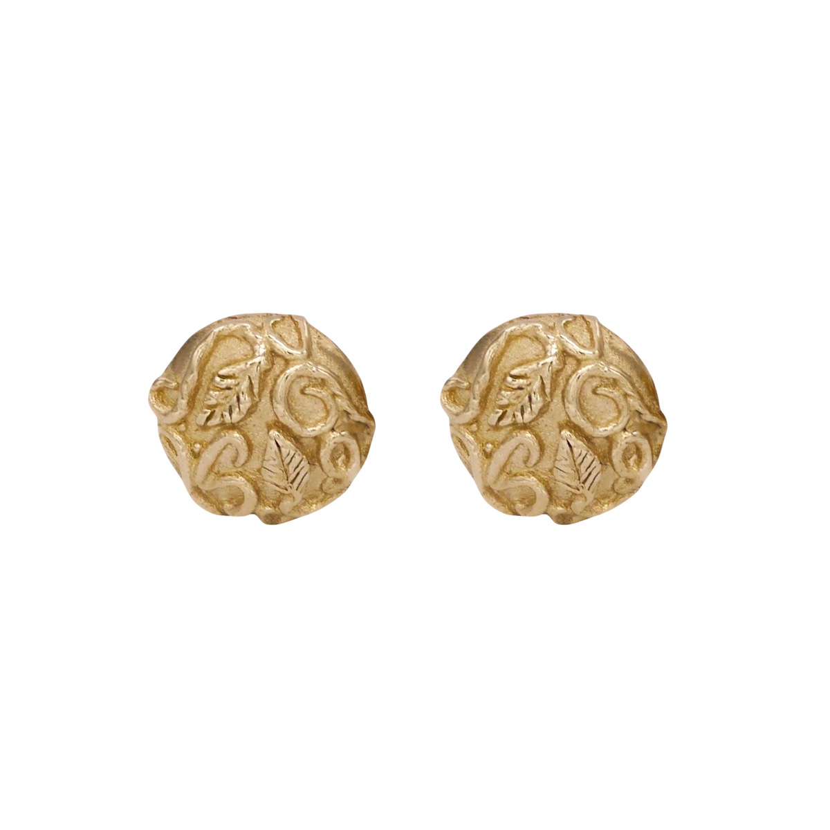 Revelation Stud Earrings — Round yellow-gold studs display raised leaves and scrolling vines across softly irregular textured faces.