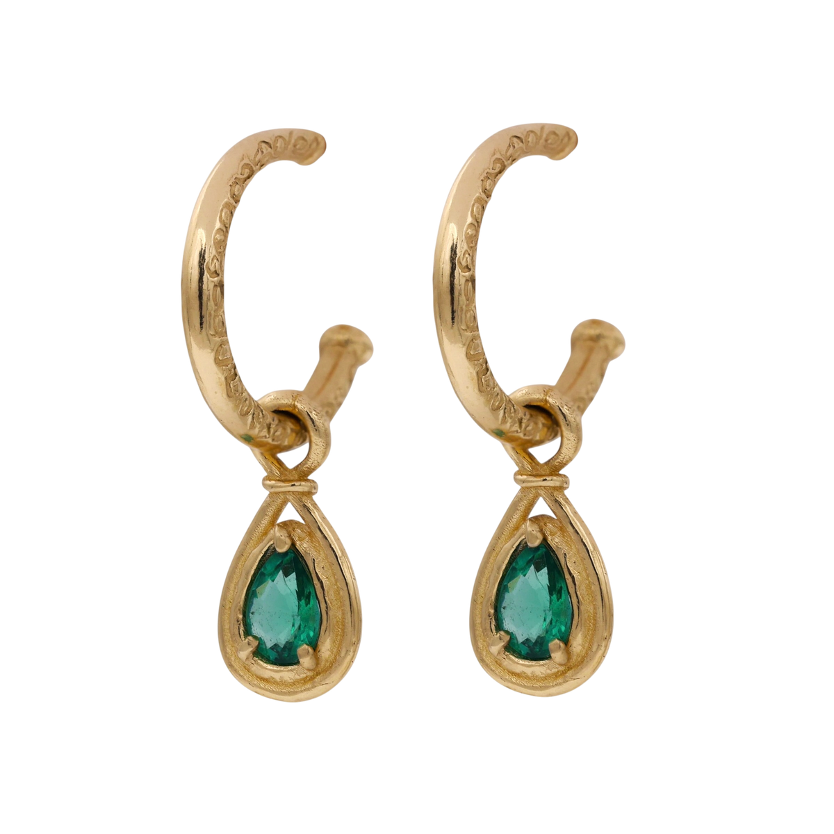 Emerald Teardrop Earrings — three-quarter view of the hoops and suspended emerald drops.