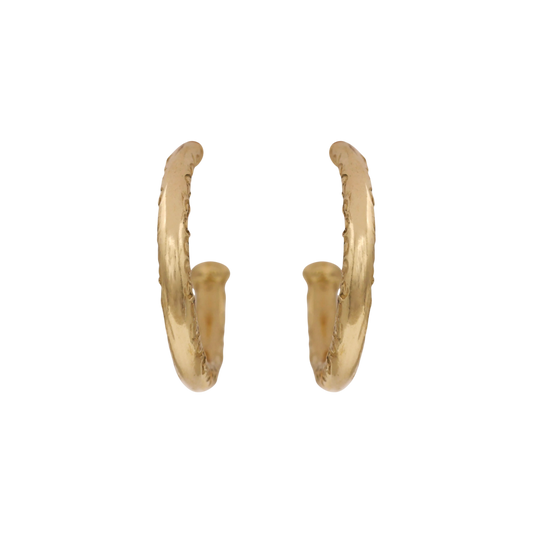 Scribe Hoops — Open yellow-gold hoops pair a rounded polished profile with subtle scrolling texture along the front edge.
