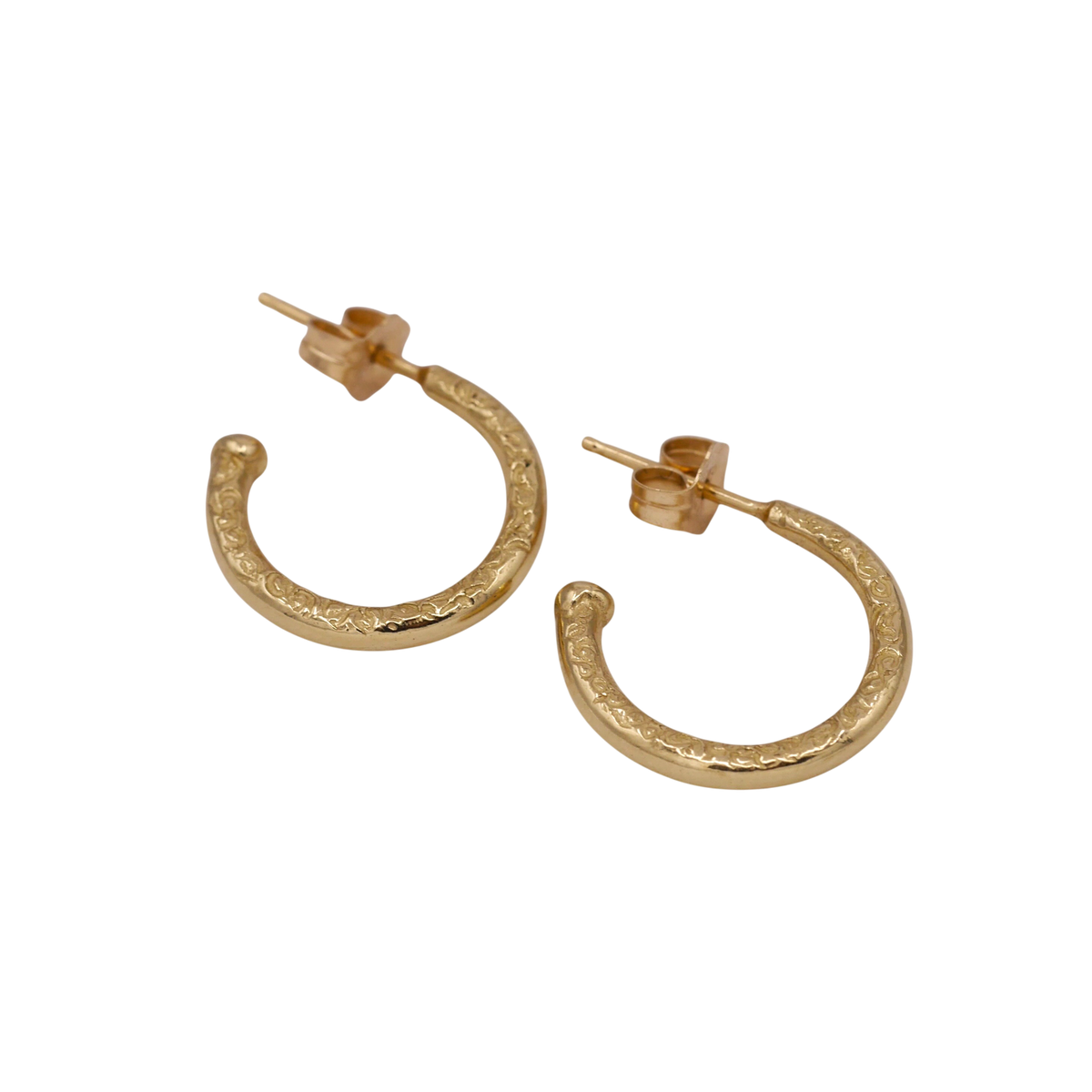 Scribe Hoops — angled view showing the posts, butterfly backs, and textured sides.