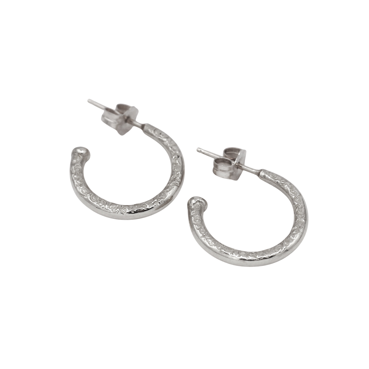 Scribe Hoops Silver — angled view showing the posts, butterfly backs, and textured silver sides.