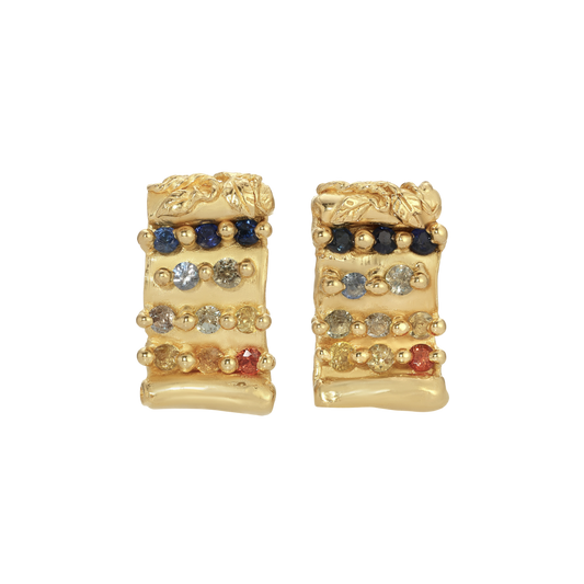 Tabula Rasa Earrings — Two yellow-gold-colored scroll-shaped studs carry 22 round multicolor sapphires in horizontal rows beneath leaf-carved upper edges.