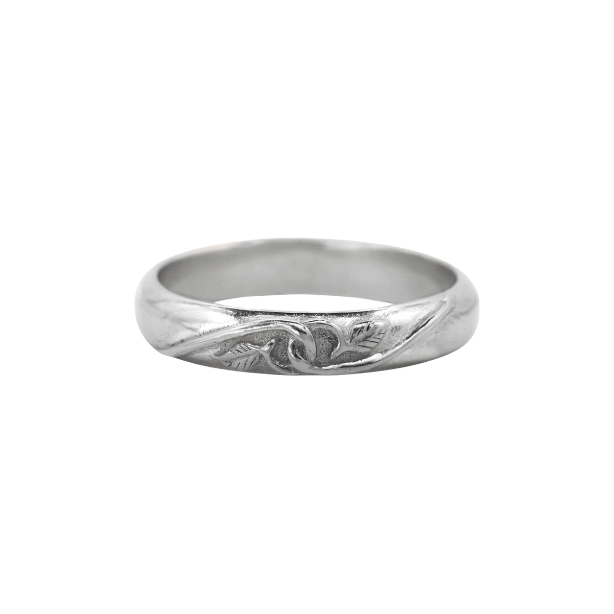 Tethered Ring Silver — A sterling-silver band has a softly domed profile with a recessed vine-and-leaf motif across its front.