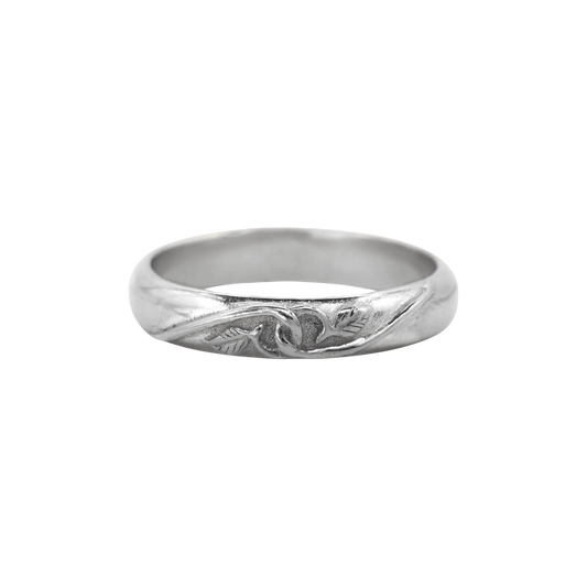 Tethered Ring Silver — A sterling-silver band has a softly domed profile with a recessed vine-and-leaf motif across its front.