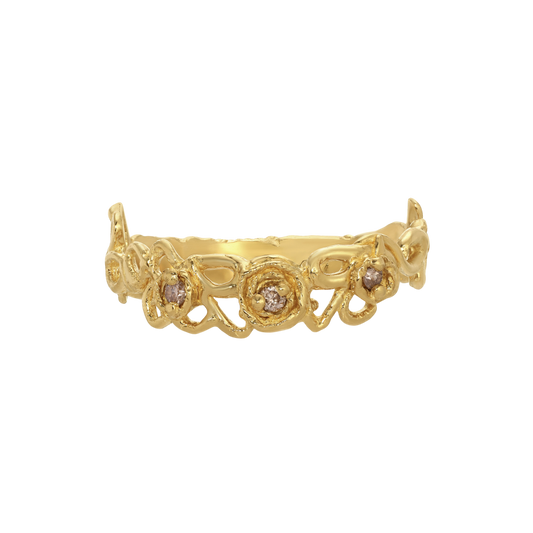 Whirl Of Diamonds Ring — Three round champagne diamonds are prong-set inside raised spiral motifs along an open scrolling yellow-gold-colored band.